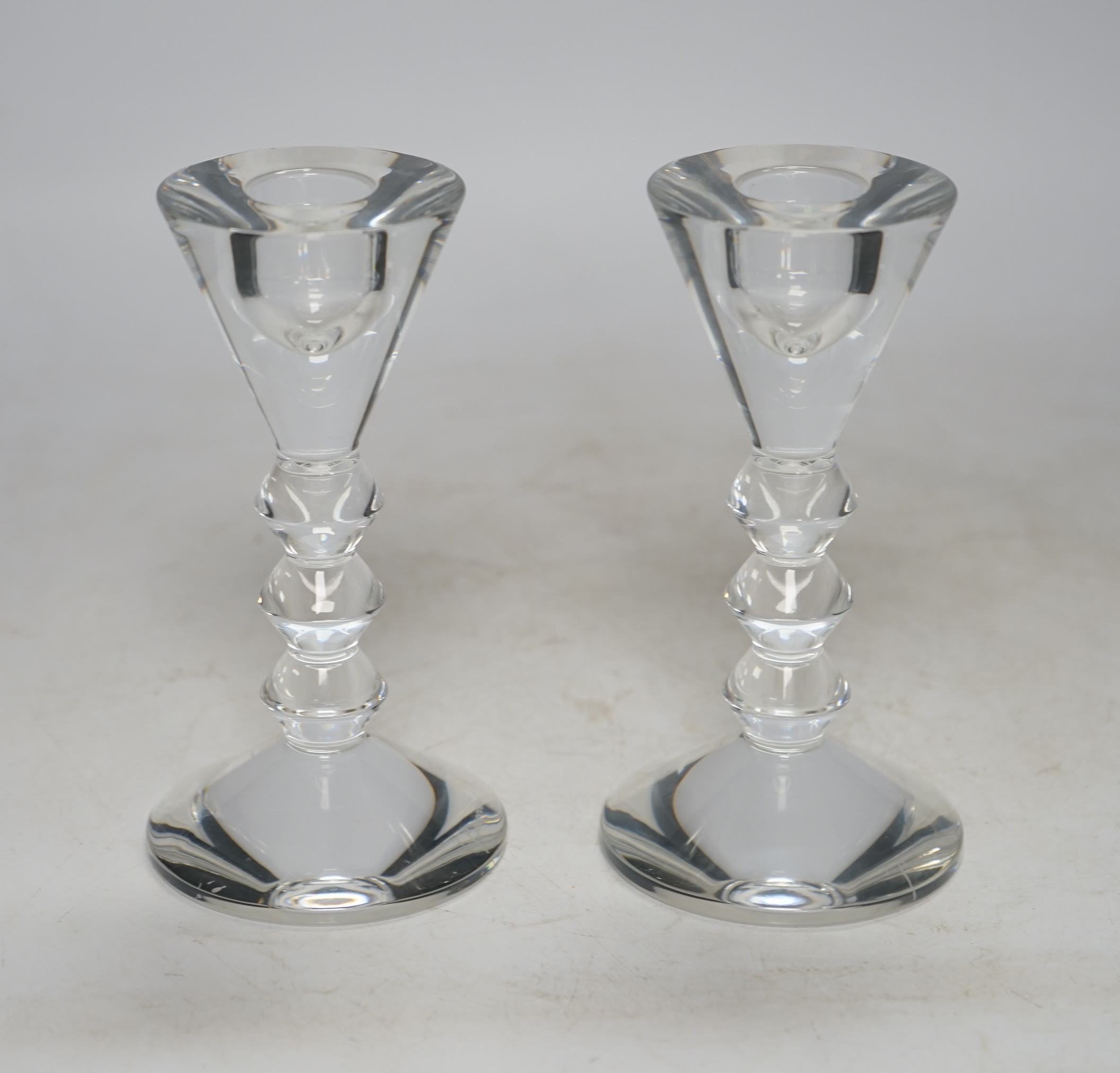 Two boxed Baccarat glass candlesticks, 13cm high. Condition - good